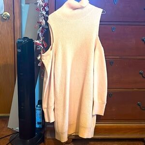 A cute sweater dress, with turtle neck, has never been worn and no tags
